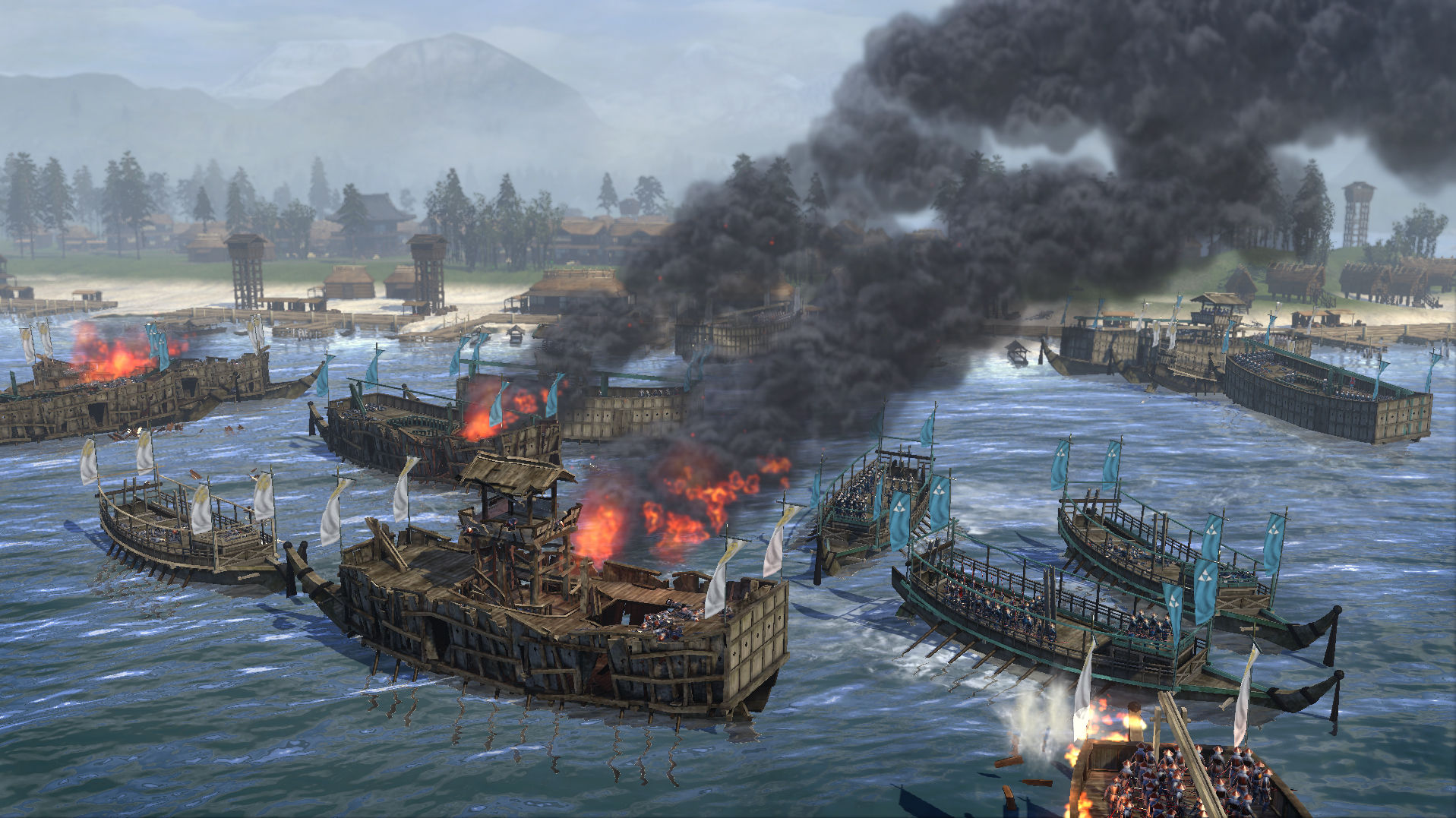 A Total War: SHOGUN 2 naval battle with burning wooden warships and black smoke rising over a coastal harbour