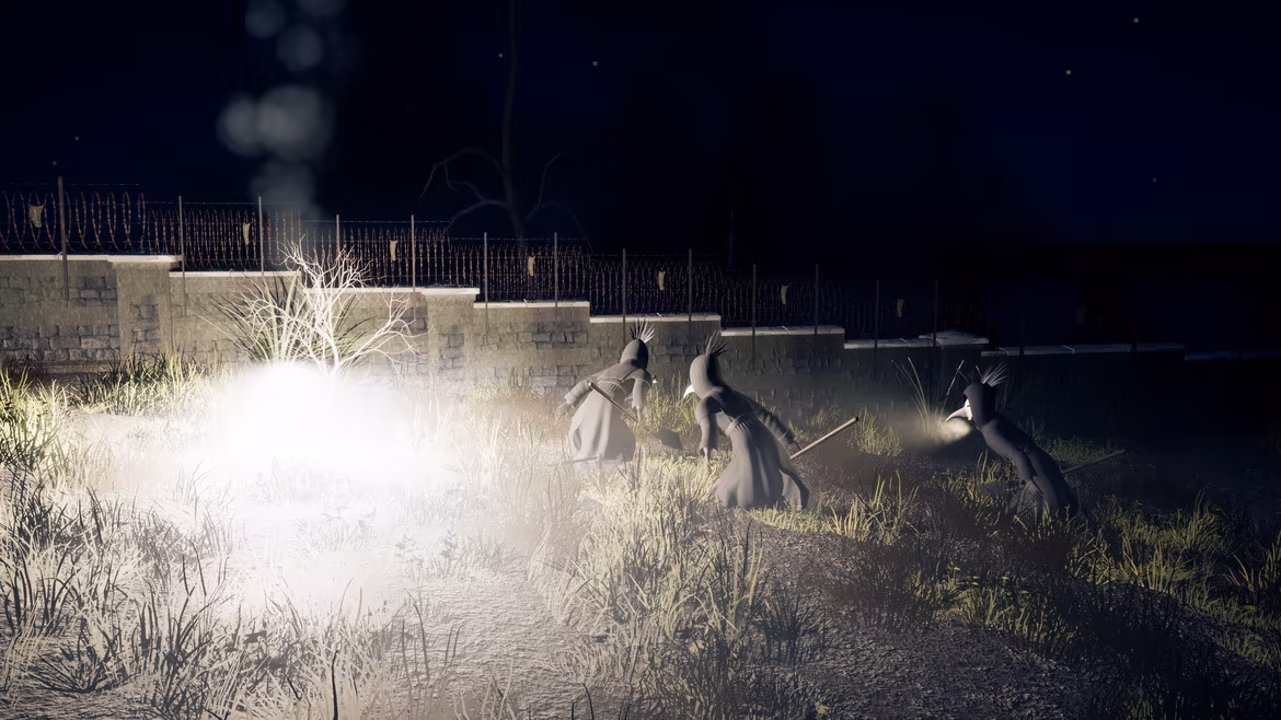 By a wire-topped wall on a hilltop at night, a trip flare burns white in the grass and sends up a column of smoke while three crewmates with shovels crouch away from its glare.
