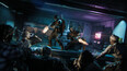Members of the Zombies crew fend off an attacking horde of Zombies in the Exit 115 diner within Ashes of the Damned.