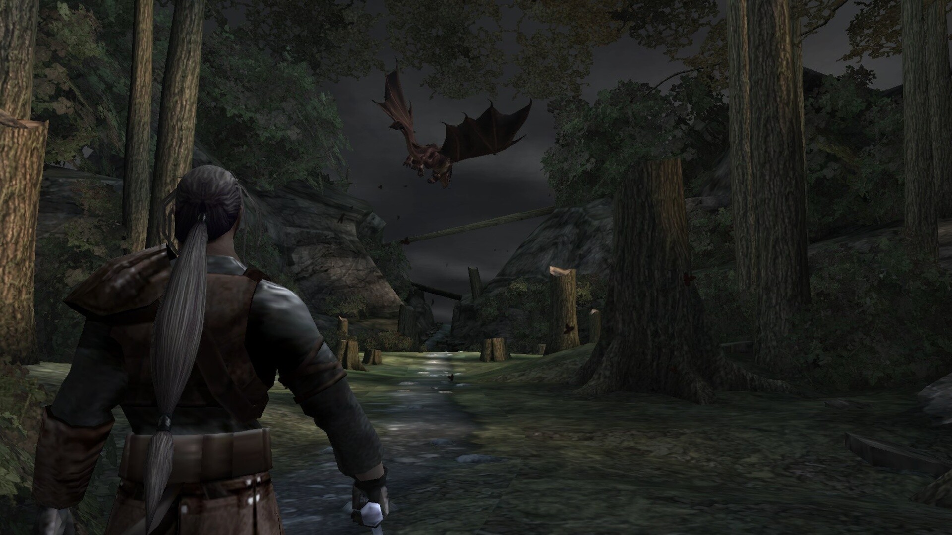 The scene depicts a figure with long gray hair tied in a ponytail, dressed in medieval-style armor, standing on a dirt path in a dense, dark forest. Tall trees surround the area, some of which have been cut down, leaving stumps scattered along the path. In the distance, a large, bat-like creature with outstretched wings is flying menacingly through the gloomy sky, adding a sense of danger to the moody, nighttime environment.