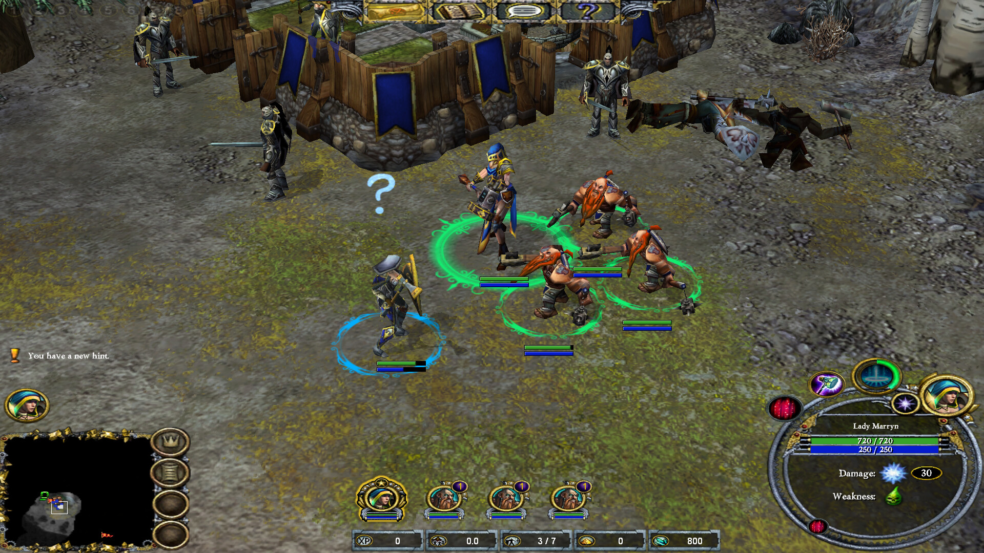 The image shows a fantasy-themed video game scene featuring a group of characters standing on a rugged, grassy ground near a small wooden and stone fortress adorned with blue banners. In the center, there is a blue-clad female warrior holding a staff, surrounded by three muscular, red-bearded dwarves wielding hammers, all highlighted by green circles beneath them. Nearby, an armored soldier with a shield and sword stands with a blue circle beneath and a question mark above his head, indicating a prompt or interaction. The bottom of the screen displays a user interface with character portraits, health and mana bars, and various stats and icons.