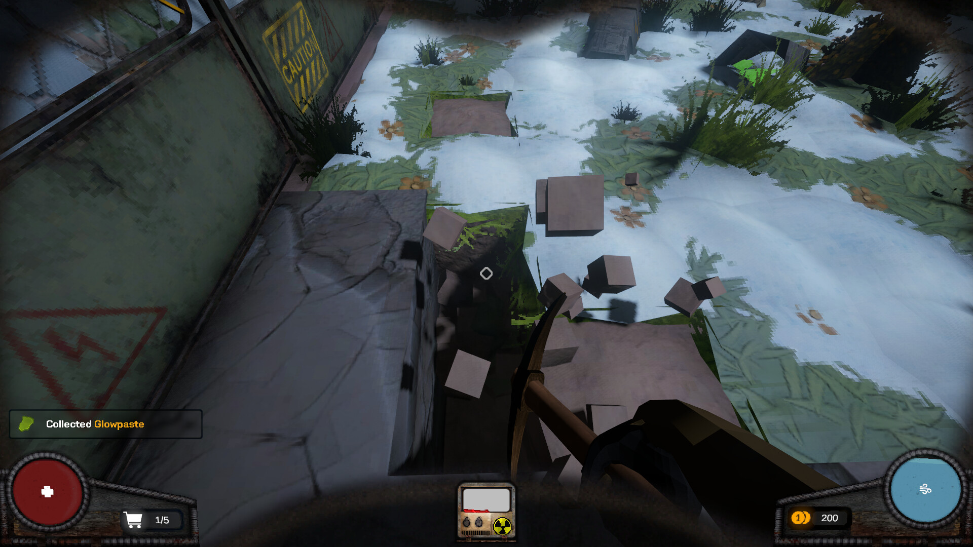 The image shows a first-person view from a video game, where the player is using a pickaxe to break apart a rocky surface, causing several cubic fragments to scatter into the air. The ground below is covered in patches of snow and green grass, with some plants and debris scattered around. A metallic structure with a faded caution sign and a red warning symbol is visible on the left side, suggesting an industrial or abandoned environment. The game interface displays a notification indicating the collection of 'Glowpaste,' along with health, inventory, and currency icons at the screen's edges.