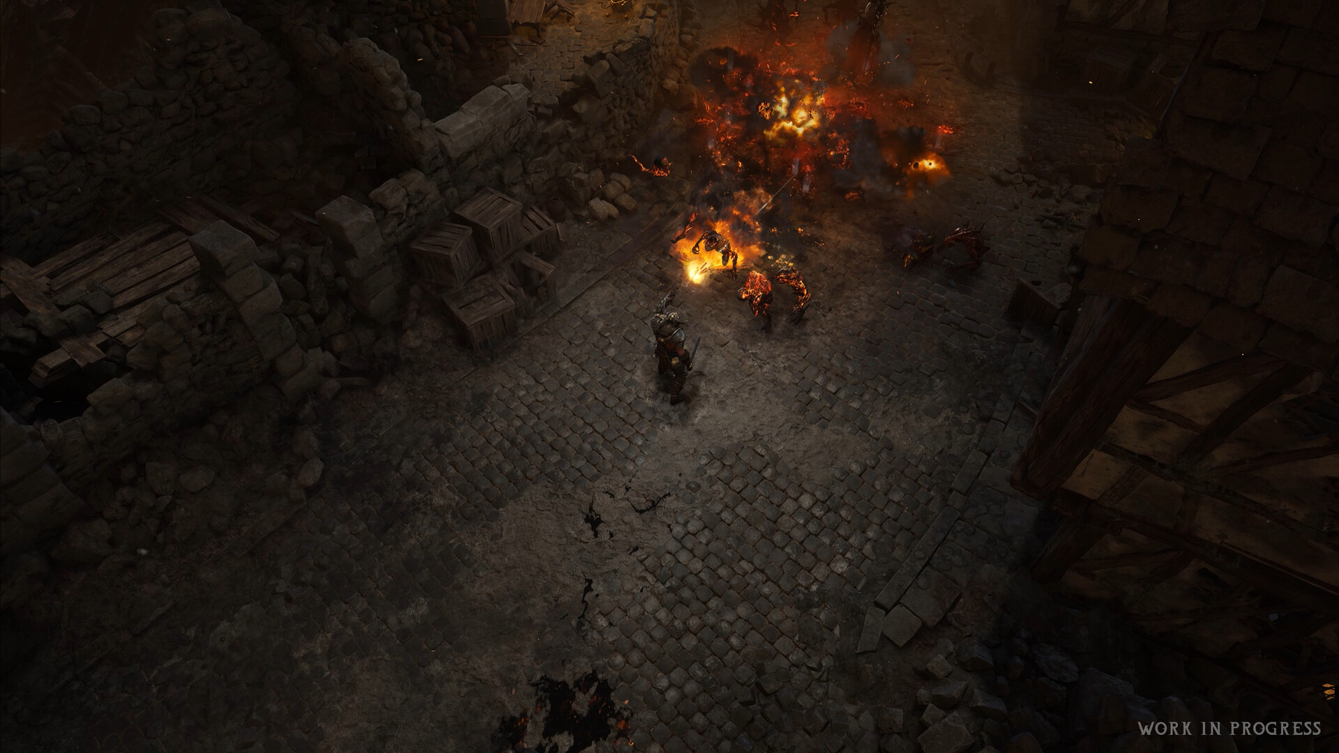 Wolcen 2 公式スクリーンショット 石畳の路地で炎に包まれた敵に魔法を放つ場面