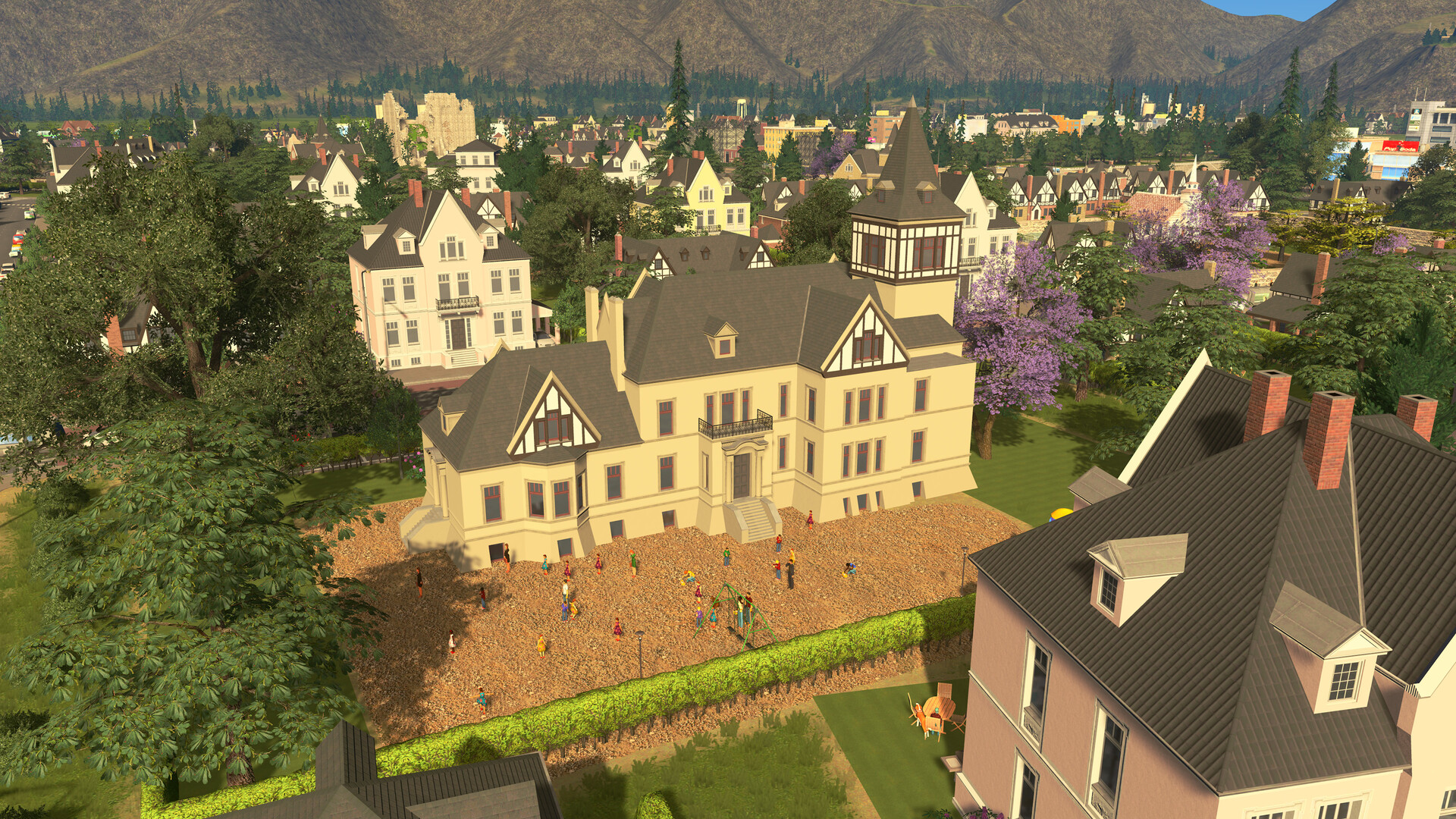 A cream Tudor-style mansion with a turret and a gravel courtyard full of citizens, surrounded by other large period houses and trees with purple blossom