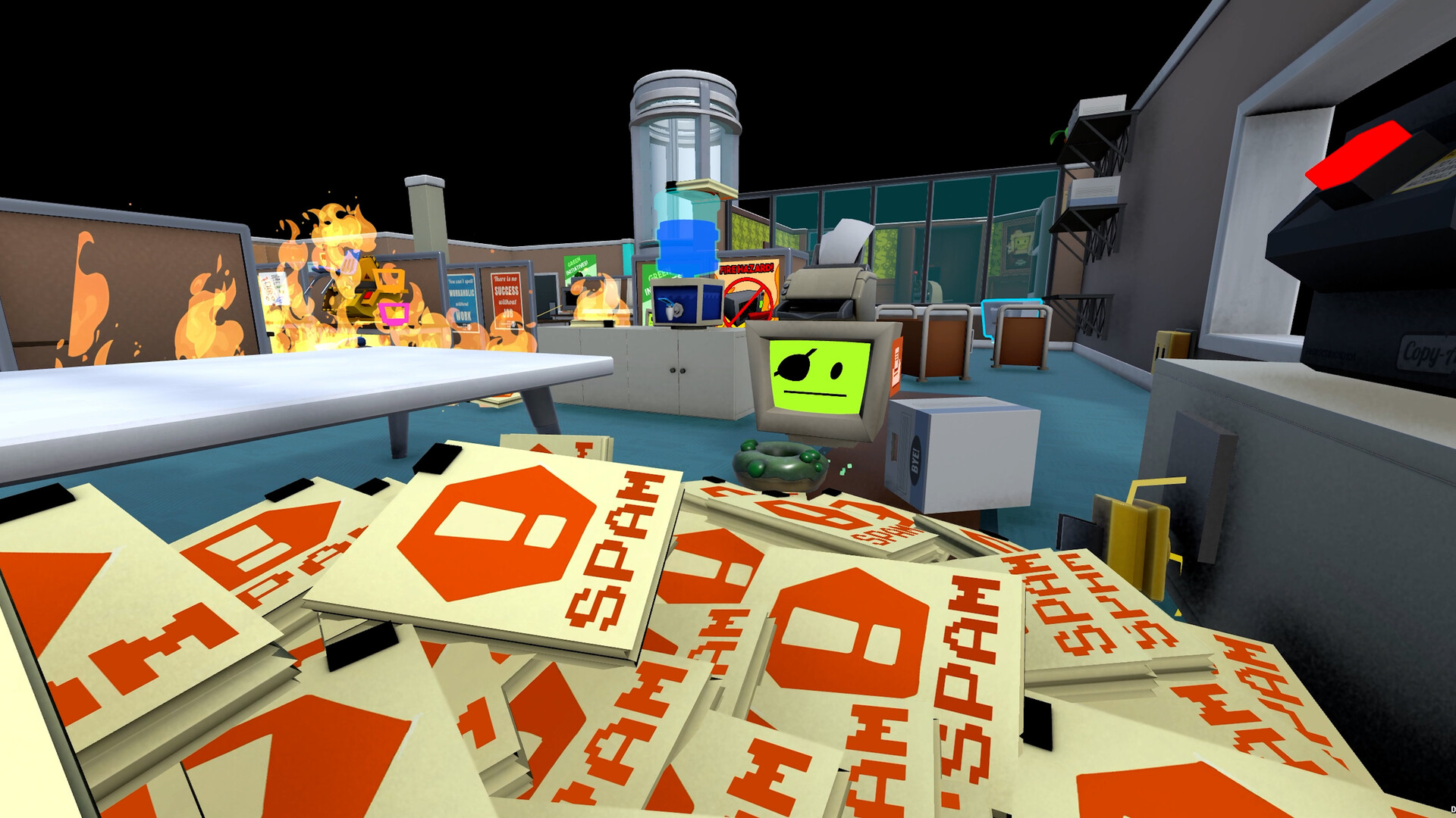 An office in Job Simulator: Human Relations with a pile of oversized SPAM folders in the foreground, a cubicle on fire, and a bot watching from behind a desk