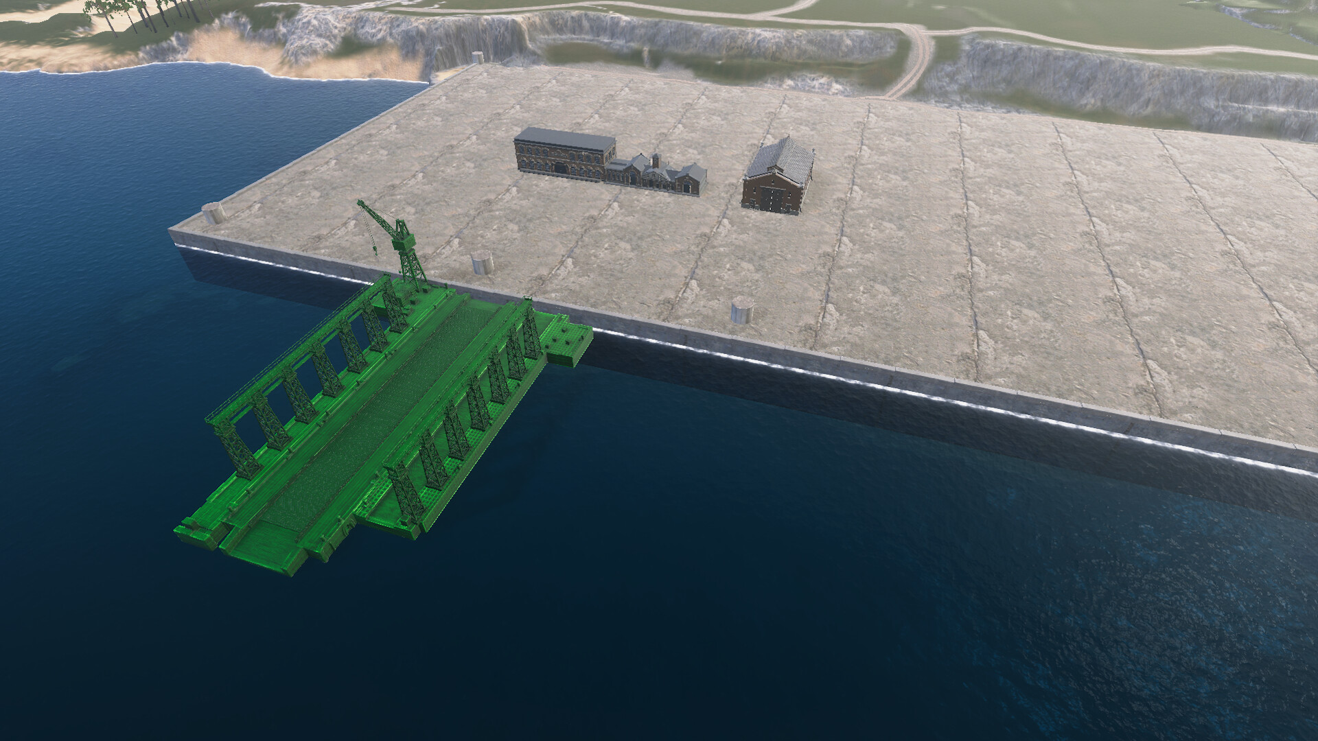 海に面した造船所の岸壁。緑色で表示された造船台の配置の様子と、クレーン、レンガ造りの建物が見える