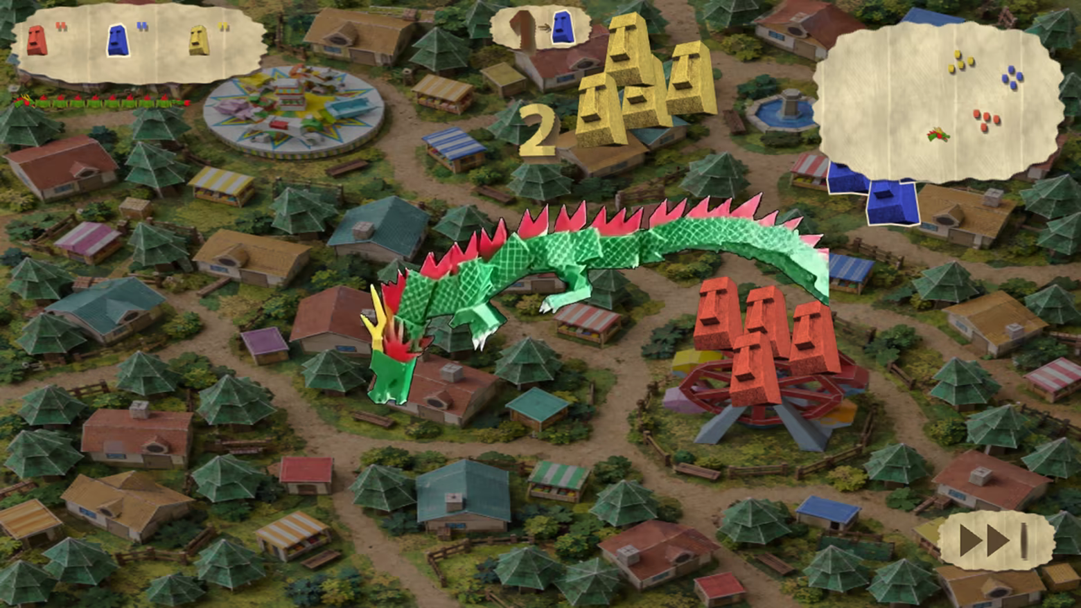 Green handmade paper dragon flying above a miniature town, with colored paper enemies and pictogram interface.